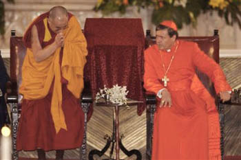 The Dalai Lama takes a seat equal to Cardinal Rivera