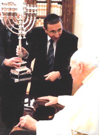 John Paul II receives a menorah from Rabbi Marvin