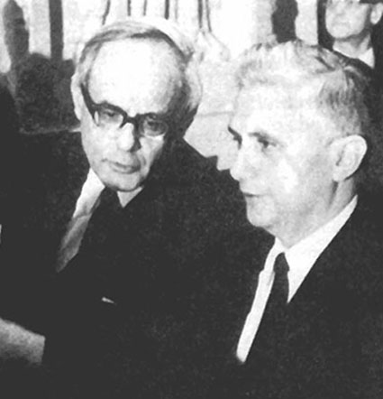 A black and white photograph of Fr. Ratzinger speaking with Karl Rahner