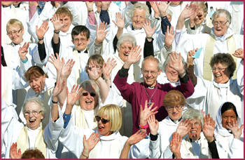 Justin Welby surrounded by women priests