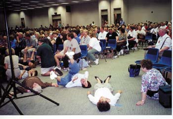 People rolling on the floor during a charismatic ceremony