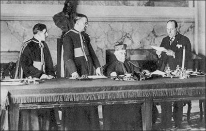 Benito Mussolini and Card. Gasparri at the signing of the Lateran Treaty