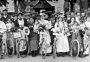 suffragettes marching with bicycles