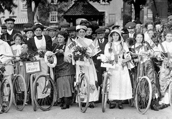 suffragettes marching with bicycles