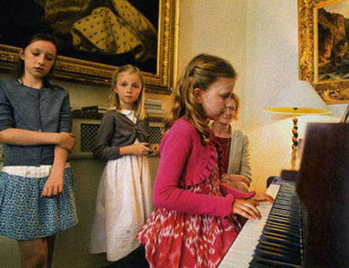 Princess Elisabeth of Belgium playing the piano for her family