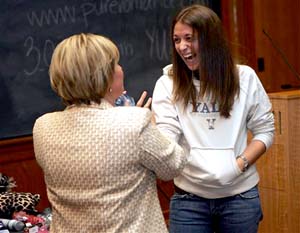 A sex toy saleswoman shows products to a yale student