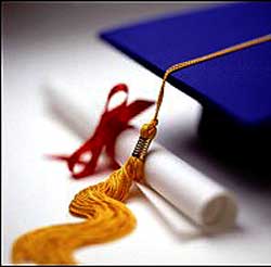 A Diploma and graduation cap