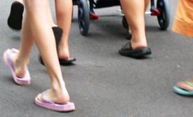 A picture of walking feet with Flipflops
