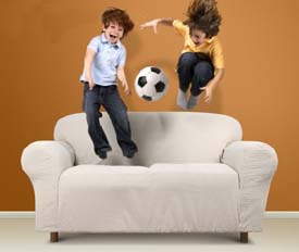 Children Jumping on a couch