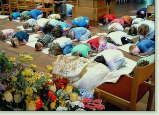 Children at the Children of Hope Church pray in Muslim style prayer positions