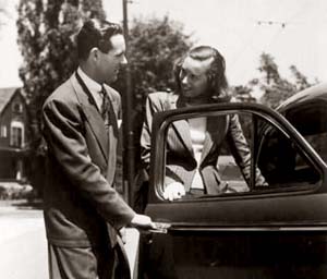 A gentleman opening a car door for a lady