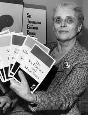 Dr. Mary Calderone holding pamphlets for sex education