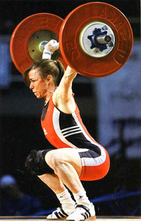 A Woman lifting a huge and heavy weight
