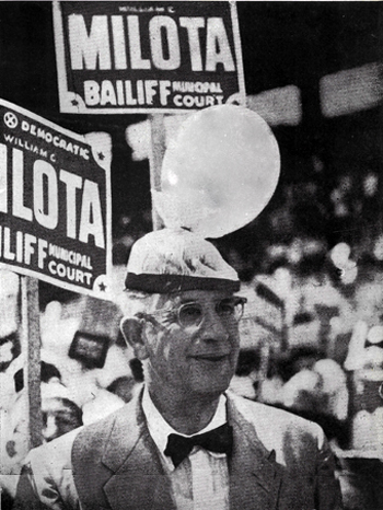 A senator wearing a balloon on his hat