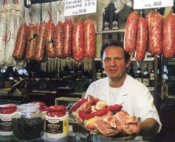 A butcher at a Lyons sausage shop