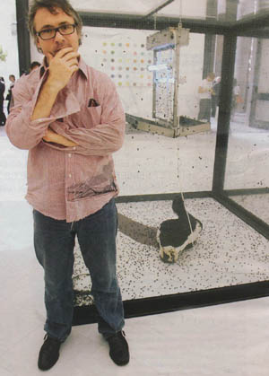 Hirst standing by his decapitated cow head art