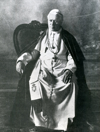 Pius X near the end of his life sitting in a chair