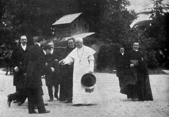 Pope Pius X greeting a visitor in the Vatican gardens