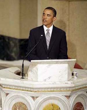 Barack Obama speaking from a pulpit