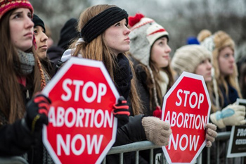 march for life portestors holding signs