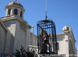 Homosexual strips in a cage dance