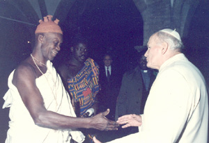John Paul II greets a voodoo witch doctor