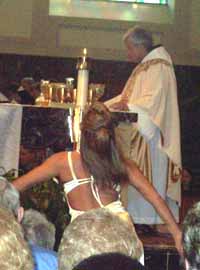 A scantily clad women allowed to attend the Novus Ordo Mass