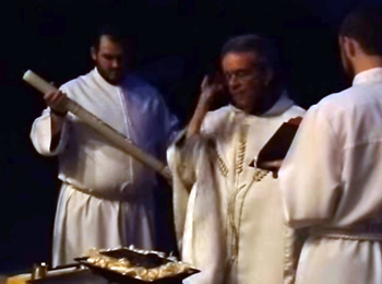 a Priest and Deacon in the blessing of the candle and fire ceremony