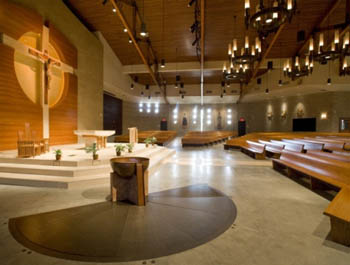 A crude and sidelines baptismal font in a modern sanctuary