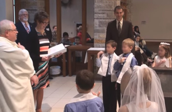 Children being taught to renew their baptismal vows