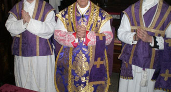 Deacon and sub-deacon wearing the folded chasuble