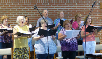 Women in pants singing in Church