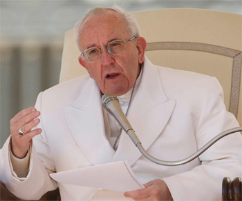 Pope Francis speaking in a white suit without a hat