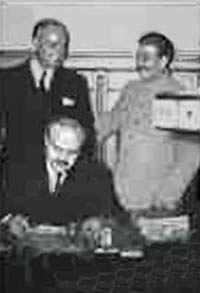 Ribbentrop, Molotov, and Stalin sign a pact in 1939