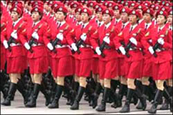 Chinese women march in a celebration of 50 years of communism