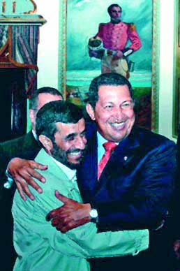Hugo Chavez and Ahmadinejad embrace