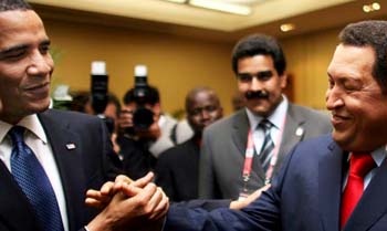 Obama shakes hands with Chavez of Venezuela