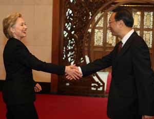Hillary Clinton shakes hands with foreign minister Yang Jiechi