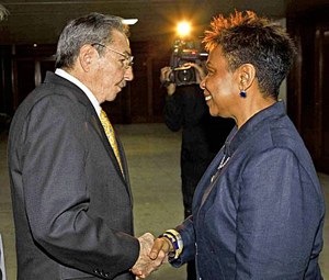 Barbara Lee shakes hands with Raul Castro