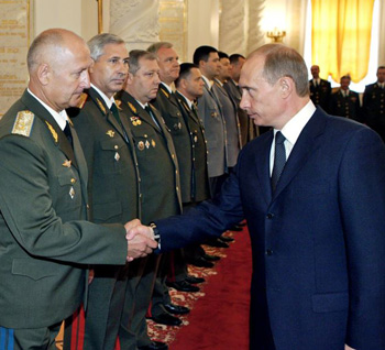 chekist Putin reviews the military