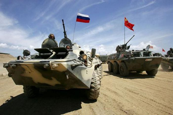 Russian and Chinese military vehicles practicing together