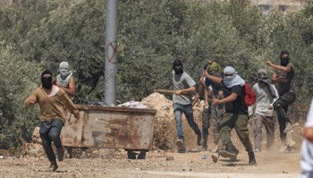 Israeli settlers attack Palestinians