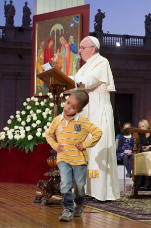 The boy on stage with pope francis