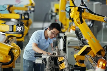 Chinese worker in automated factory