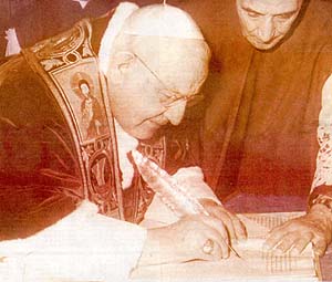 John XIII signs the opening of Vatican II