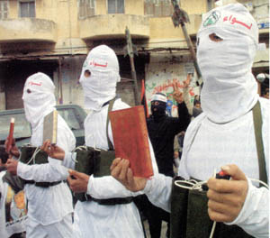 Muslim youths with the Koran in one hand and suicide detonators in the other