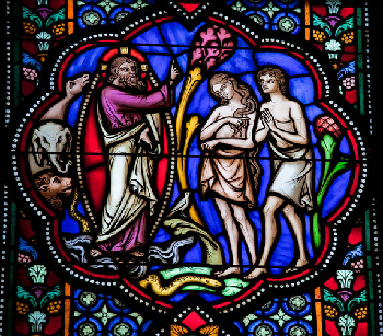Stained glass window depicting God, Adam, and Eve