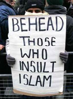 A man carrying a threatening pro-Islamic sign