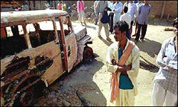 The hulk of a burned bus in India