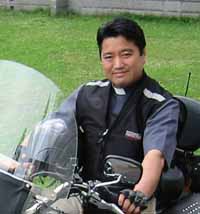 A Japanese priest on a motorcycle